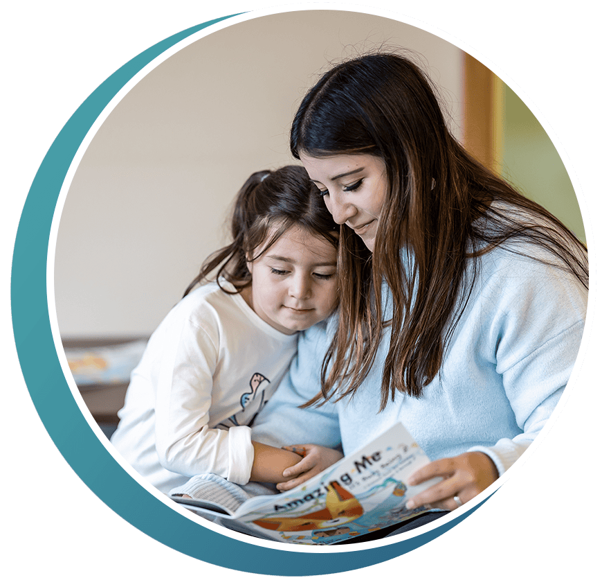 mother and daughter reading a magazine in the waiting room at the doctors office