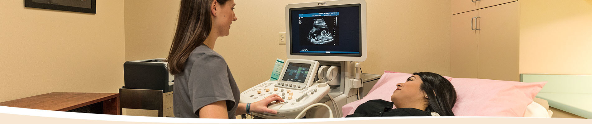 Woman receiving ultrasound.